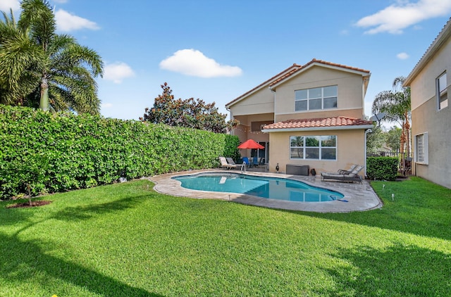 8110 Brigamar Isles Ave, Boynton Beach, FL 33473 - back of house with a tile roof, stucco siding, a patio, and a yard
