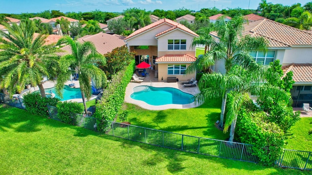 8110 Brigamar Isles Ave, Boynton Beach, FL 33473 - rear view of house with a tiled roof, a fenced backyard, stucco siding, and a patio