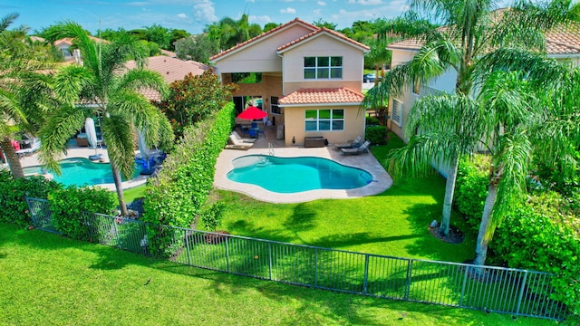 8110 Brigamar Isles Ave, Boynton Beach, FL 33473 - rear view of property with a tile roof, a fenced backyard, stucco siding, and a patio