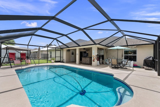 397 SW Jeanne Ave, Port Saint Lucie, FL 34953 - outdoor pool with a patio area, ceiling fan, area for grilling, and a lanai