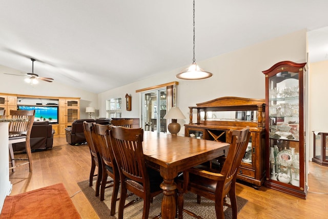 397 SW Jeanne Ave, Port Saint Lucie, FL 34953 - dining room featuring light wood-style floors, lofted ceiling, and a ceiling fan