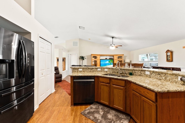 397 SW Jeanne Ave, Port Saint Lucie, FL 34953 - kitchen featuring fridge with ice dispenser, open floor plan, dishwasher, ceiling fan, and vaulted ceiling