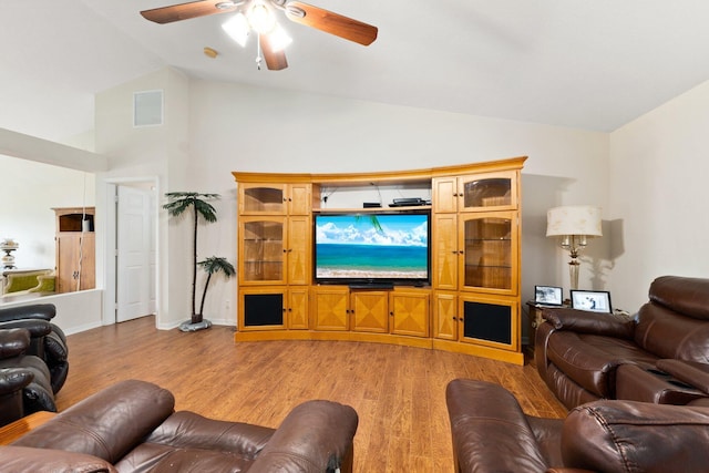 397 SW Jeanne Ave, Port Saint Lucie, FL 34953 - living area featuring light wood-style floors, ceiling fan, and high vaulted ceiling