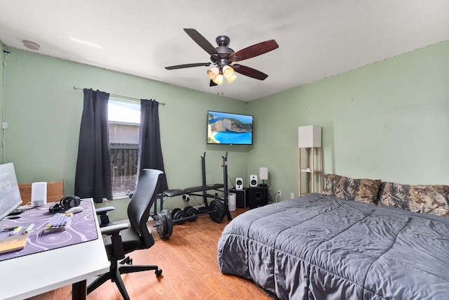 397 SW Jeanne Ave, Port Saint Lucie, FL 34953 - bedroom featuring wood finished floors, a desk, and ceiling fan