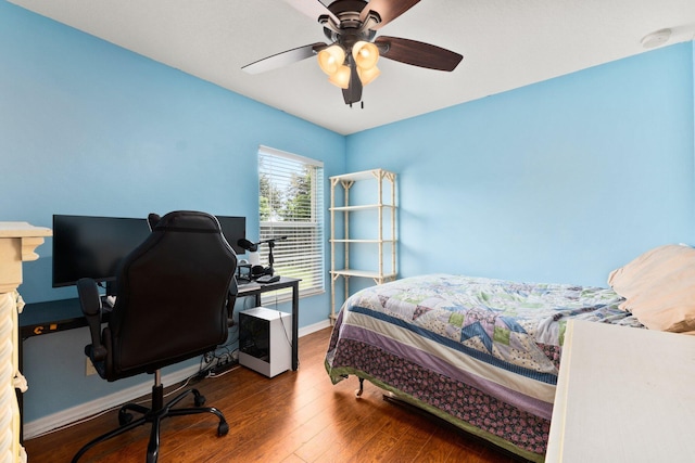 397 SW Jeanne Ave, Port Saint Lucie, FL 34953 - bedroom featuring wood finished floors, an office area, and a ceiling fan