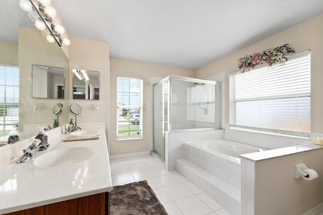 397 SW Jeanne Ave, Port Saint Lucie, FL 34953 - full bath with double vanity, a shower stall, a garden tub, and tile patterned floors