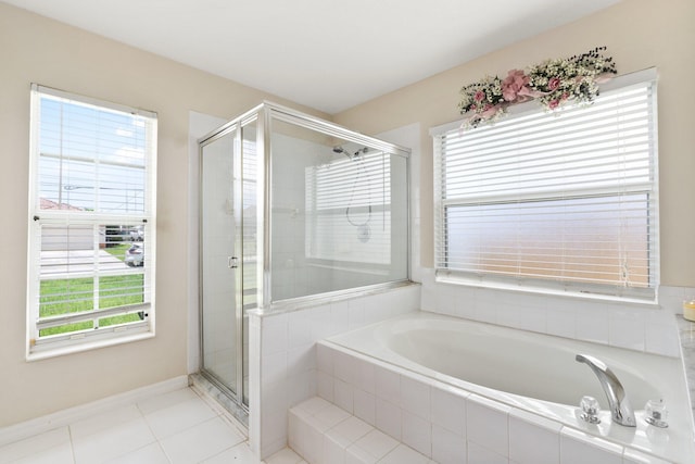 397 SW Jeanne Ave, Port Saint Lucie, FL 34953 - full bath featuring a garden tub, a stall shower, and tile patterned flooring