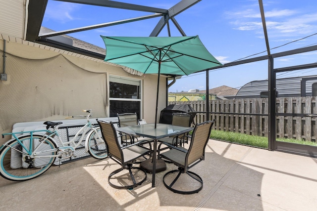 397 SW Jeanne Ave, Port Saint Lucie, FL 34953 - view of patio / terrace with glass enclosure and outdoor dining area