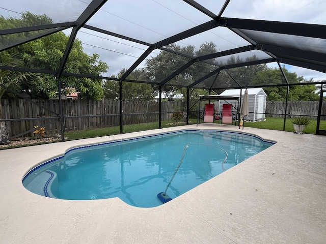 397 SW Jeanne Ave, Port Saint Lucie, FL 34953 - view of pool featuring a shed, a fenced backyard, a patio, and a lanai