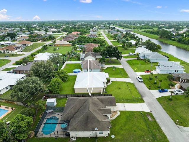 397 SW Jeanne Ave, Port Saint Lucie, FL 34953 - aerial perspective of suburban area with a pool and a nearby body of water