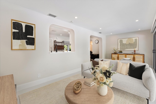 910 SW 21st St, Boca Raton, FL 33486 - living room featuring arched walkways, recessed lighting, and carpet floors