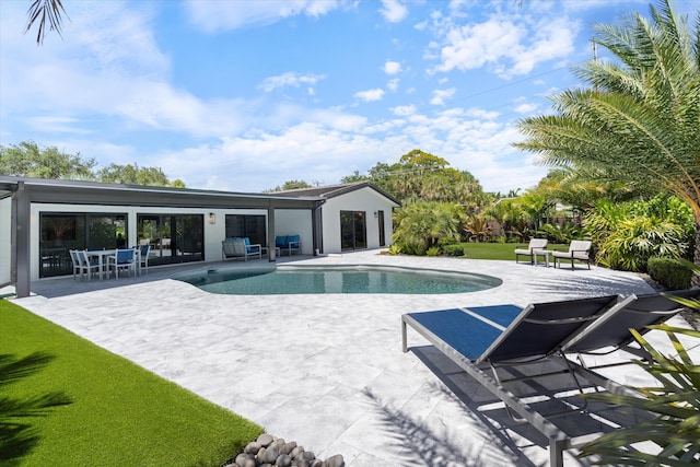 910 SW 21st St, Boca Raton, FL 33486 - outdoor pool featuring a patio and a lawn