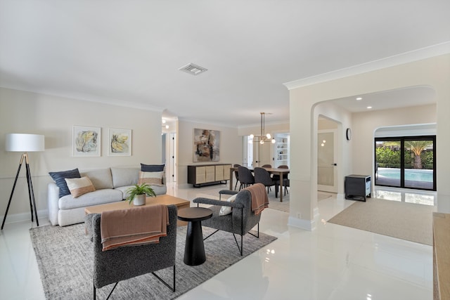 910 SW 21st St, Boca Raton, FL 33486 - living room featuring arched walkways, ornamental molding, a chandelier, and light tile patterned floors
