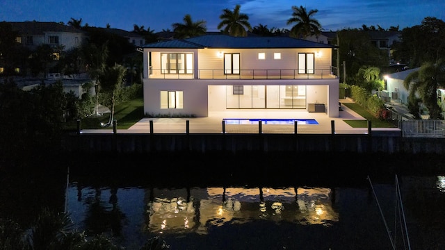811 Chukker Rd, Delray Beach, FL 33483 - back of house featuring a balcony, a patio, and stucco siding