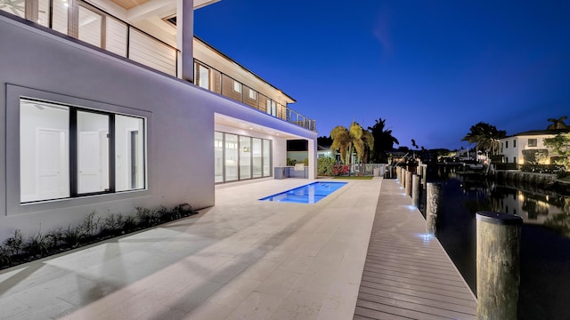 811 Chukker Rd, Delray Beach, FL 33483 - view of pool featuring a patio area and a water view