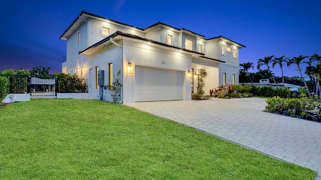 811 Chukker Rd, Delray Beach, FL 33483 - view of front of home with decorative driveway, an attached garage, a yard, and stucco siding