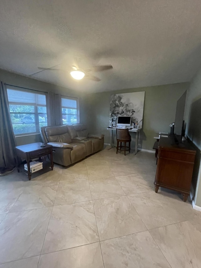 1033 Newport H Unit 1033, Deerfield Beach, FL 33442 - living area featuring a textured ceiling, ceiling fan, and a desk