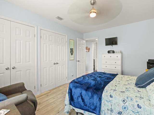 1706 Lakefront Blvd Unit D, Fort Pierce, FL 34982 - bedroom with multiple closets, wood finished floors, and a ceiling fan