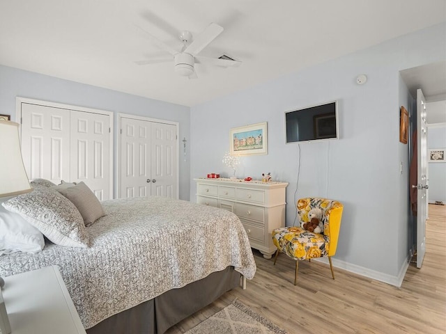 1706 Lakefront Blvd Unit D, Fort Pierce, FL 34982 - bedroom featuring two closets, light wood finished floors, and a ceiling fan