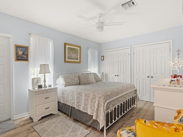 1706 Lakefront Blvd Unit D, Fort Pierce, FL 34982 - bedroom with multiple closets, light wood-style flooring, and a ceiling fan