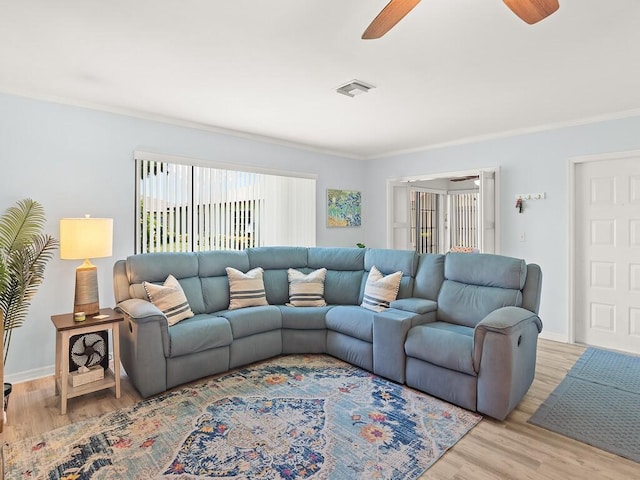 1706 Lakefront Blvd Unit D, Fort Pierce, FL 34982 - living area with ceiling fan, light wood finished floors, and ornamental molding