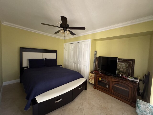 674 Springdale Cir, Palm Springs, FL 33461 - bedroom featuring ornamental molding, a closet, a ceiling fan, and light tile patterned floors