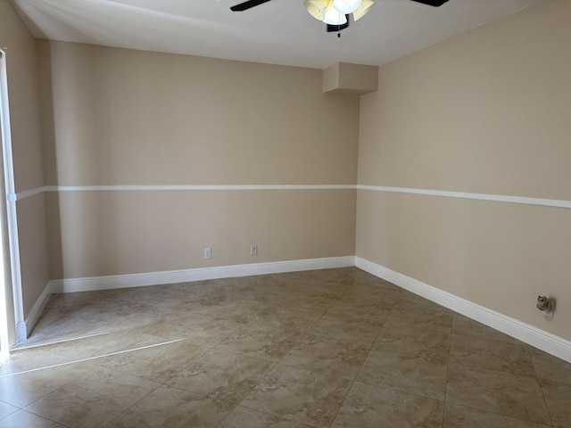 674 Springdale Cir, Palm Springs, FL 33461 - spare room with a ceiling fan and baseboards