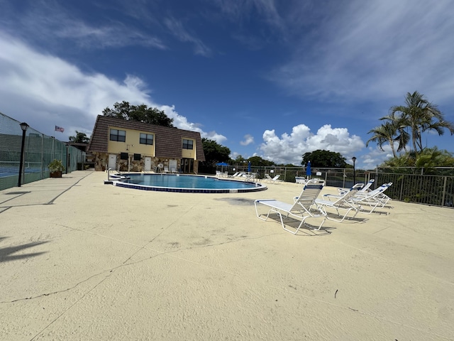 674 Springdale Cir, Palm Springs, FL 33461 - community pool with a patio