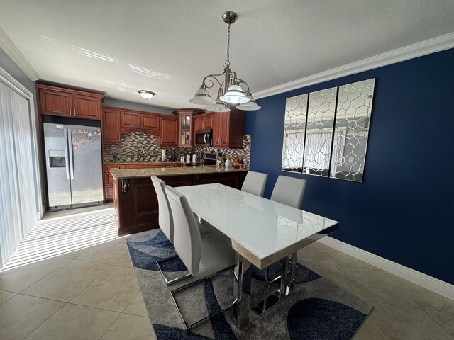 674 Springdale Cir, Palm Springs, FL 33461 - dining room with light tile patterned floors, crown molding, and a chandelier