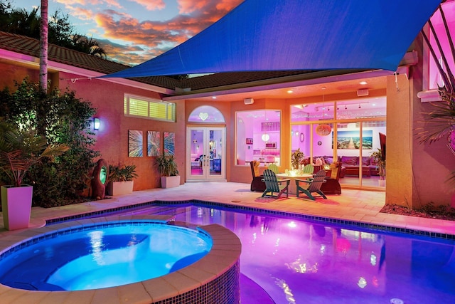 191 Sedona Way, Palm Beach Gardens, FL 33418 - view of pool featuring french doors, a patio area, and a pool with connected hot tub
