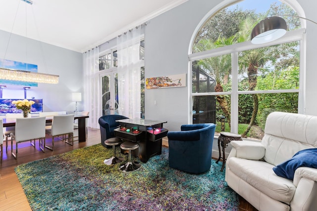 191 Sedona Way, Palm Beach Gardens, FL 33418 - living area with french doors, ornamental molding, and wood finished floors