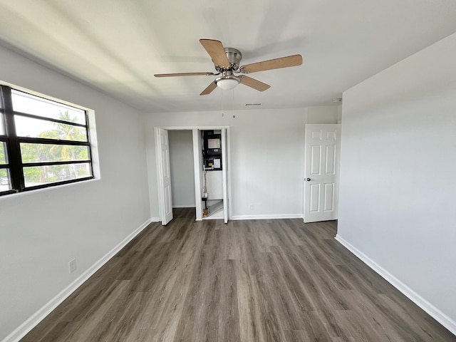 5163 Marion Pl, West Palm Beach, FL 33407 - unfurnished bedroom with wood finished floors, ceiling fan, and a closet