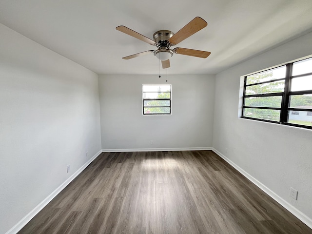 5163 Marion Pl, West Palm Beach, FL 33407 - unfurnished room with dark wood finished floors and a ceiling fan