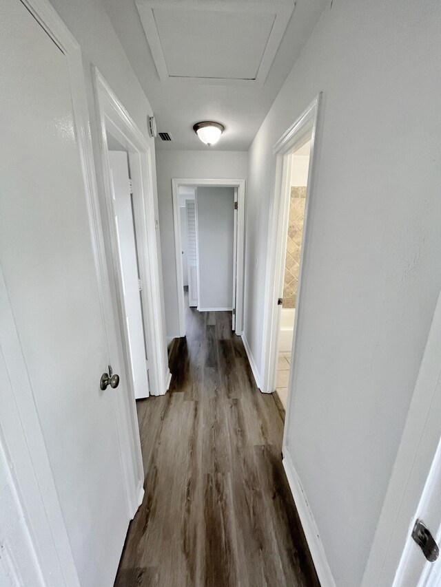 5163 Marion Pl, West Palm Beach, FL 33407 - corridor featuring wood finished floors and attic access