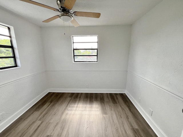 5163 Marion Pl, West Palm Beach, FL 33407 - empty room with wood finished floors and a ceiling fan