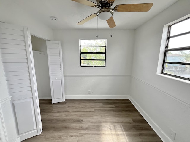 5163 Marion Pl, West Palm Beach, FL 33407 - unfurnished bedroom featuring wood finished floors and ceiling fan