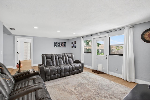 826 Cochran Dr, Lake Worth Beach, FL 33461 - living room featuring wood finished floors and recessed lighting