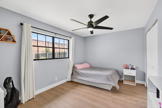 826 Cochran Dr, Lake Worth Beach, FL 33461 - bedroom with light wood-style floors, ceiling fan, and a closet