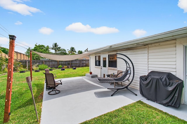 826 Cochran Dr, Lake Worth Beach, FL 33461 - fenced backyard featuring a grill and a patio area