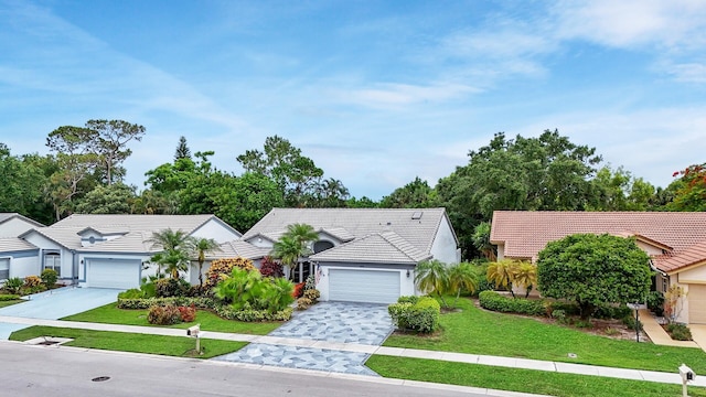 8291 Lake Cypress Rd, Lake Worth, FL 33467 - single story home with an attached garage, driveway, a tiled roof, and a front yard