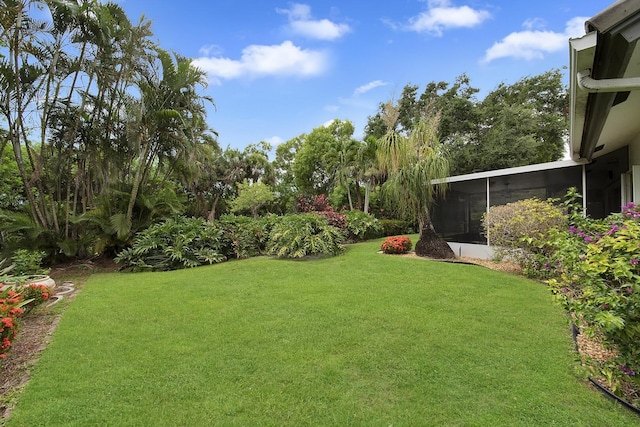 8291 Lake Cypress Rd, Lake Worth, FL 33467 - view of green lawn featuring a sunroom