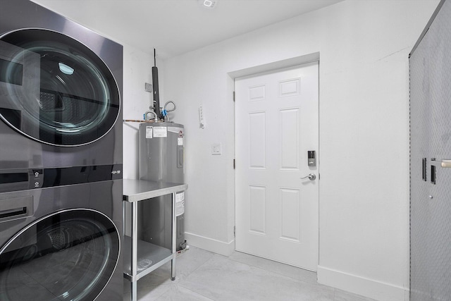 2800 NE 48th St, Lighthouse Point, FL 33064 - laundry room with stacked washing machine and dryer and electric water heater