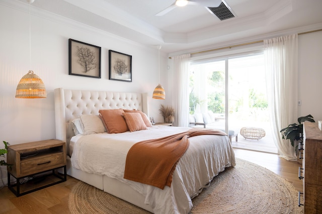 3245 Wymberly Dr, Jupiter, FL 33458 - bedroom featuring access to outside, ornamental molding, a tray ceiling, wood finished floors, and a ceiling fan