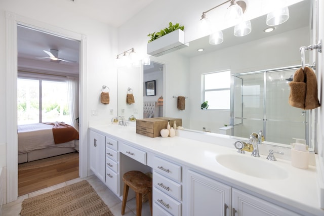 3245 Wymberly Dr, Jupiter, FL 33458 - bathroom featuring double vanity, plenty of natural light, a shower stall, and ensuite bath
