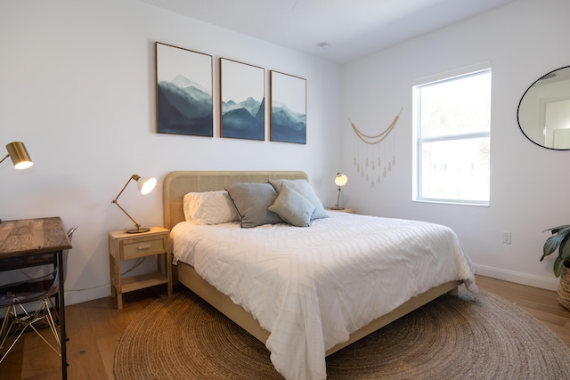 3245 Wymberly Dr, Jupiter, FL 33458 - bedroom with wood finished floors and baseboards