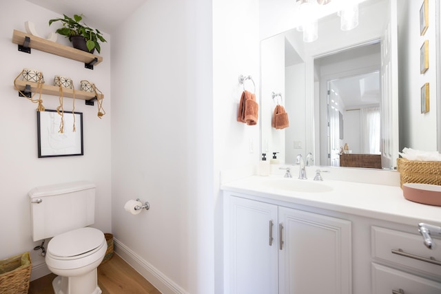 3245 Wymberly Dr, Jupiter, FL 33458 - half bath with vanity and wood finished floors
