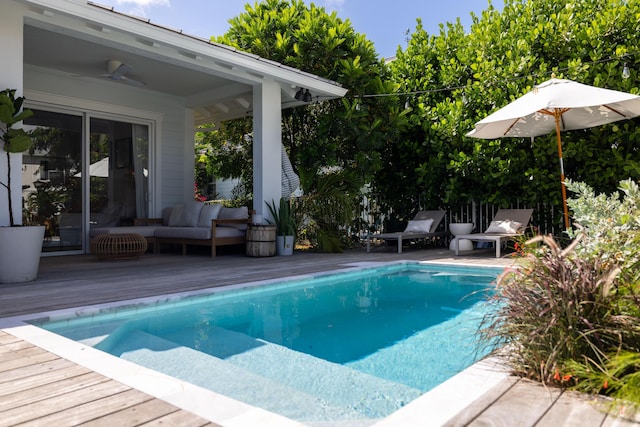 3245 Wymberly Dr, Jupiter, FL 33458 - outdoor pool featuring a deck, a ceiling fan, and outdoor lounge area