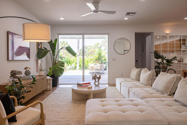 3245 Wymberly Dr, Jupiter, FL 33458 - living room featuring ceiling fan, wood finished floors, recessed lighting, and a textured ceiling
