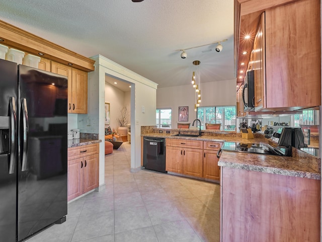 10828 Lake Palm Ln Unit 202, Boynton Beach, FL 33437 - kitchen featuring black appliances, light tile patterned floors, a textured ceiling, and hanging light fixtures