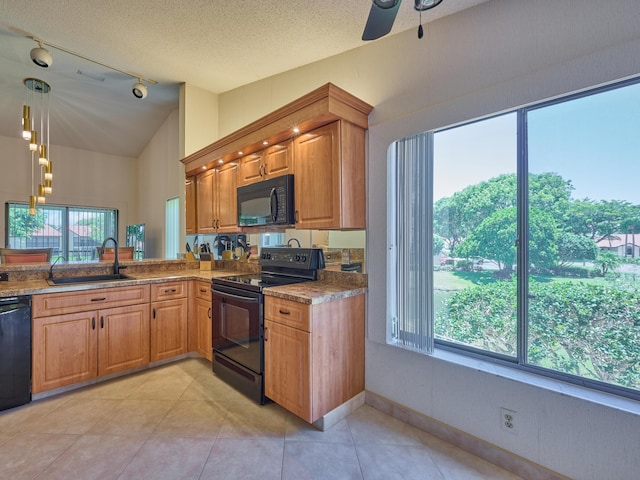 10828 Lake Palm Ln Unit 202, Boynton Beach, FL 33437 - kitchen featuring black appliances, track lighting, brown cabinets, ceiling fan, and a textured ceiling
